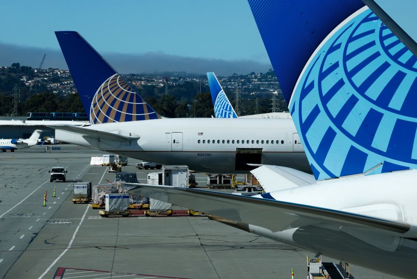 United Airlines planes sit parked at San Francisco International Airport (SFO) on November 7, 2025.