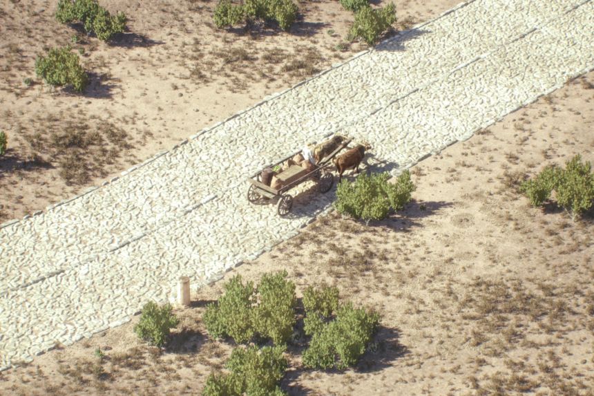 A cart navigates a Roman road with directional lanes in an image provided by Itiner-e and taken from an animation.