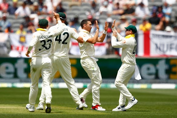 Happy days: The Australians rejoice on Saturday.