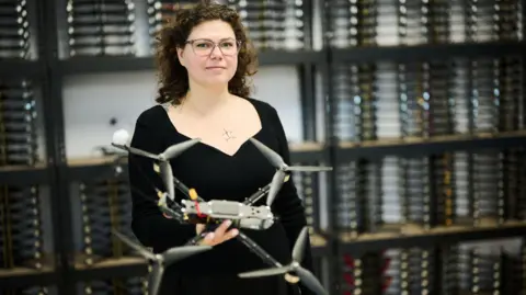 Kseniia Kalmus Kseniia Kalmus holding one of her drones