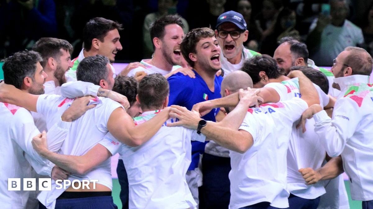 Flavio Cobolli celebrates with his team-mates after confirming Italy's Davis Cup triumph