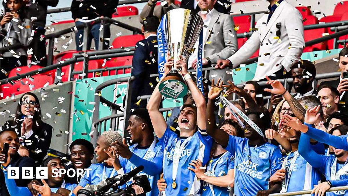 Peterborough's Hector Kyprianou lifting the EFL Trophy at Wembley