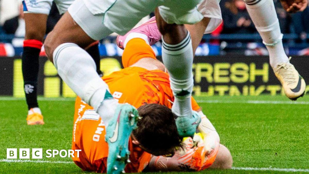 Celtic's Auston Trusty challenges Rangers' Jack Butland
