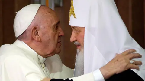 GREGORIO BORGIA/POOL/AFP Pope Francis (L) and the head of the Russian Orthodox Church, Patriarch Kirill embrace during a historic meeting in Havana on February 12, 2016