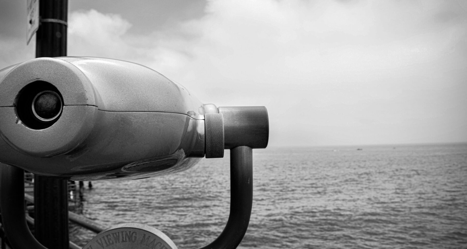 Binoculars on a ship looking to the seascape for other ships