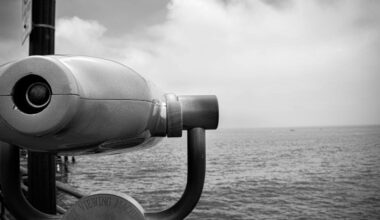 Binoculars on a ship looking to the seascape for other ships