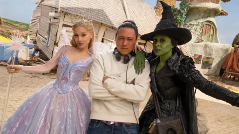 Universal Director Jon M Chu on set with Ariana Grande and Cynthia Erivo