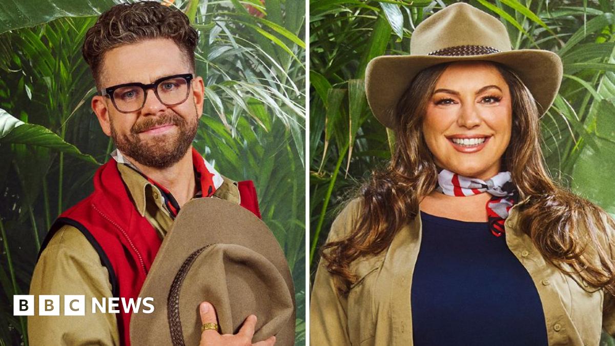 10 people can be seen wearing various outfits of red and khaki green, with some wearing large khaki hats. They are posed in front of a jungle backdrop as part of the announcement for the new cast of I'm a Celebrity...Get Me Out of Here!