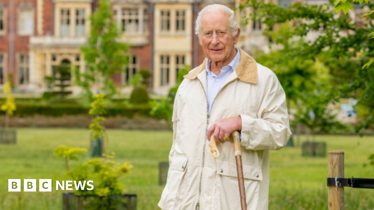 King Charles with a shepherd's crook at Sandringham in Norfolk