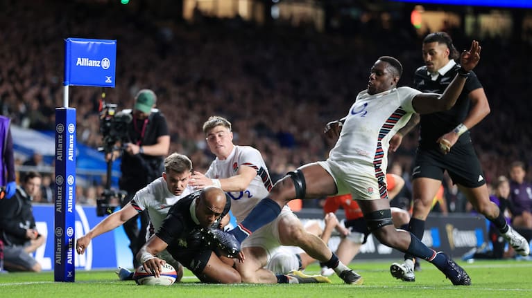 England's Maro Itoje sticks out a leg to try to prevent Mark Tele'a scoring for the All Blacks at Twickenham last November.