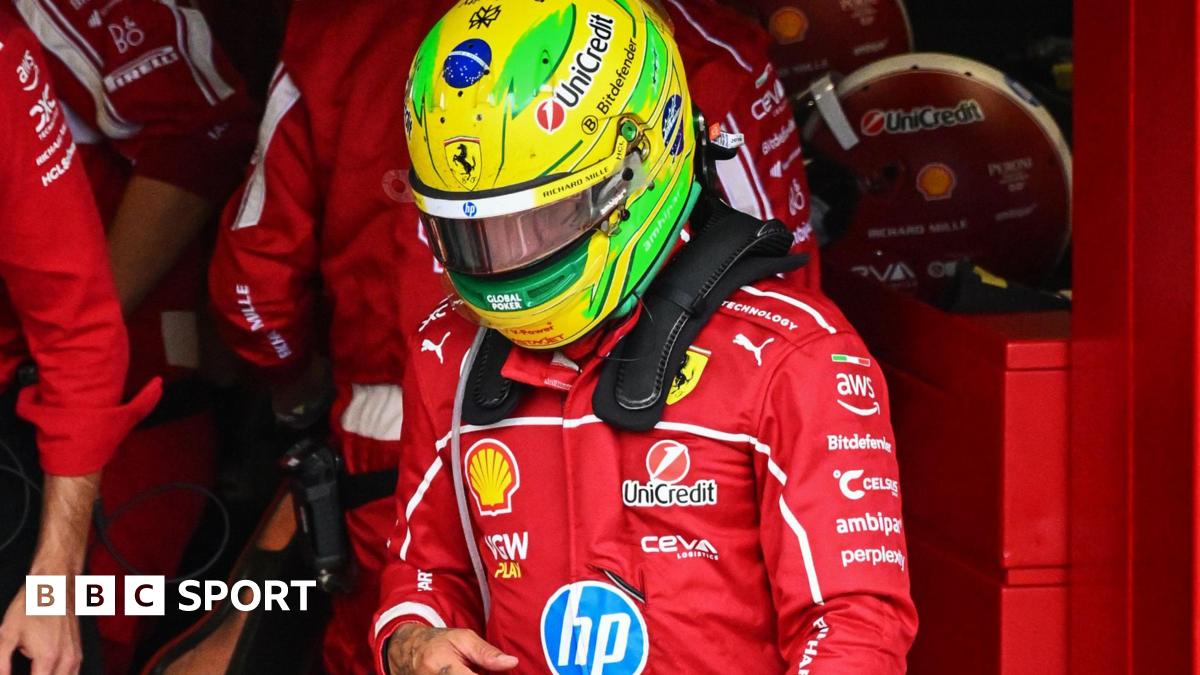 Lewis Hamilton in the pit lane after getting out of his Ferrari to retire from the Sao Paulo Grand Prix