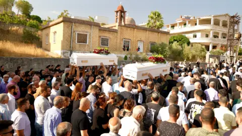 BBC/Goktay Koraltan The funeral of Wissam and Shafiq Mansour