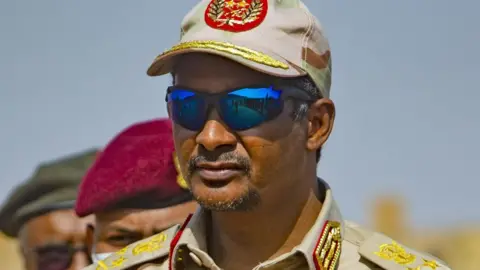 Anadolu via Getty Images RSF commander Mohamed Hamdan Dagalo in military uniform and wearing sunglasses