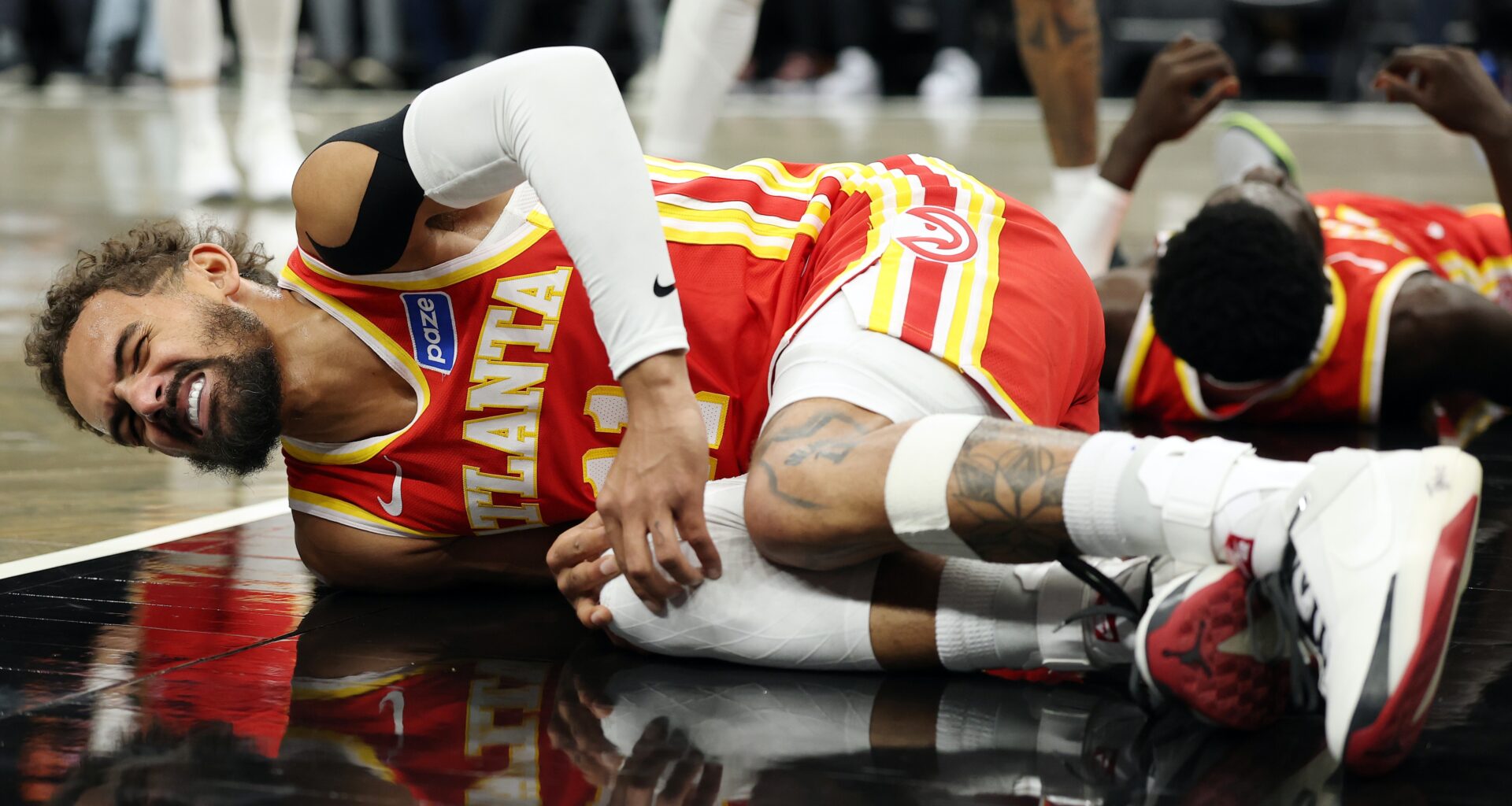 Hawks' Trae Young suffers sprained right knee vs. Nets