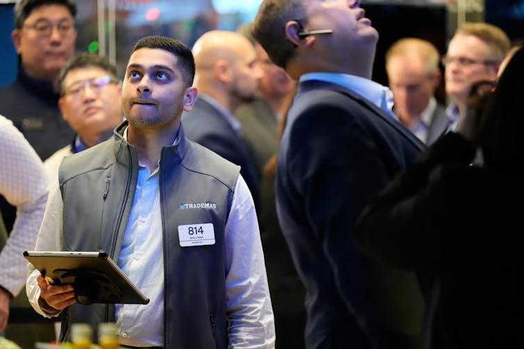 People working on the floor at the New York Stock Exchange