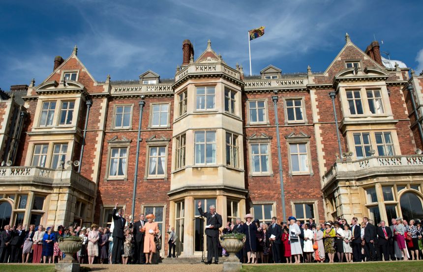 Queen Elizabeth II greets guests at a garden party in honour of her diamond jubilee at Sandringham in 2012.