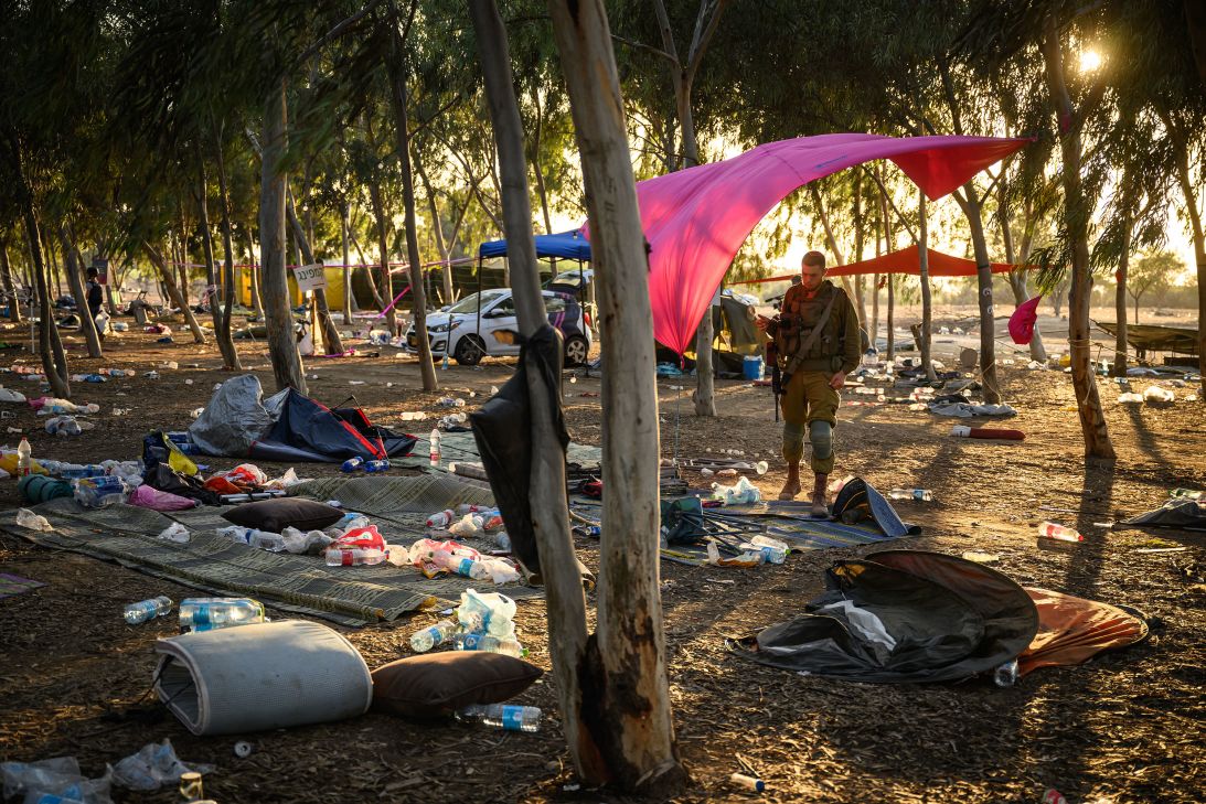 Members of Israeli security forces continue to search for identification and personal belongings at the Nova music festival site near the border with Gaza, in Kibbutz Re'im, Israel, on October 12, 2023.