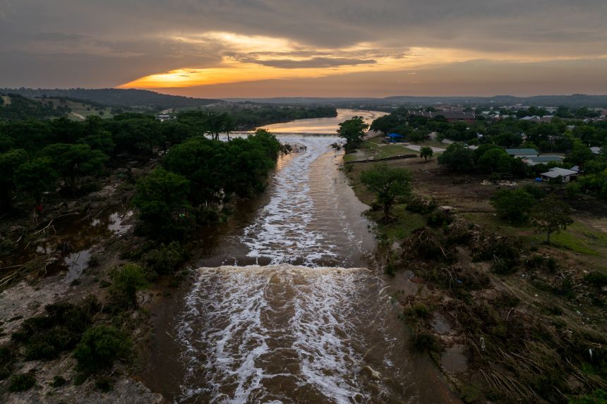 In an aerial view, the sun sets over the Guadalupe River on July 06, 2025 in Kerrville, Texas.