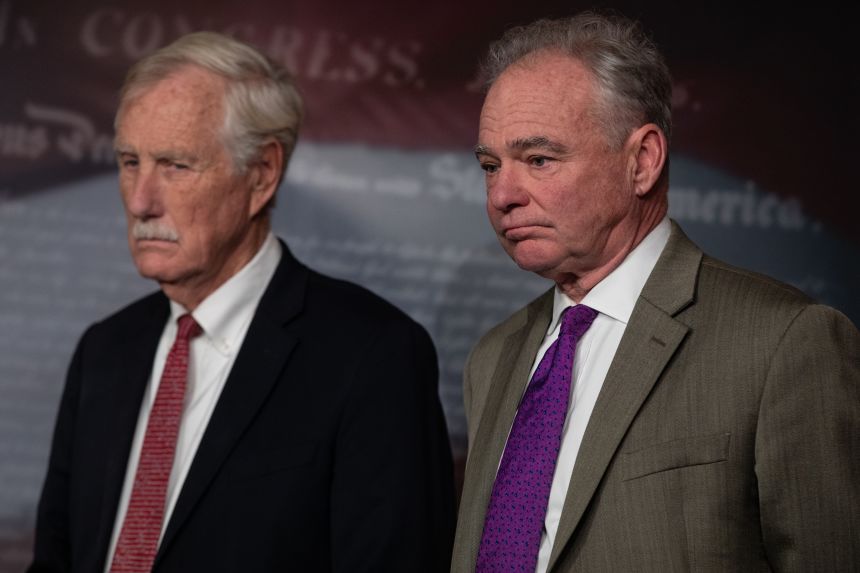 Angus King and  Tim Kaine are seen during a press conference following a vote on Capitol Hill in Washington DC, on November 9, 2025.