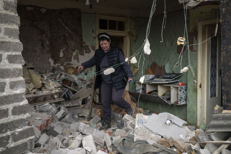 A resident is inspecting the damage after a Russian drone attack in Kramatorsk, Ukraine, on November 11, 2025.