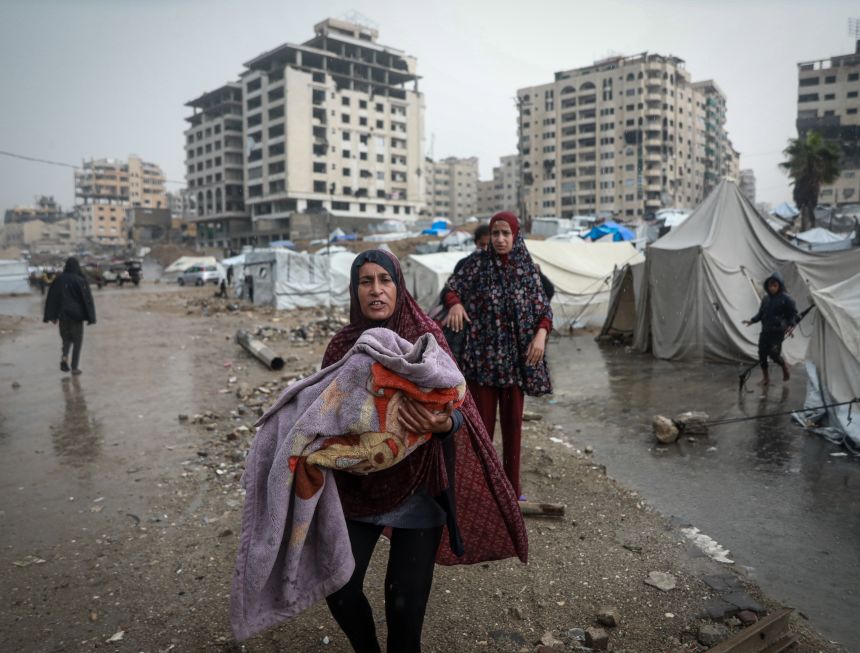 Palestinians, whose homes were destroyed during Israel's two-year attacks, have hard times after their makeshift tents were flooded with the intense rain in Gaza City, Gaza on Friday.