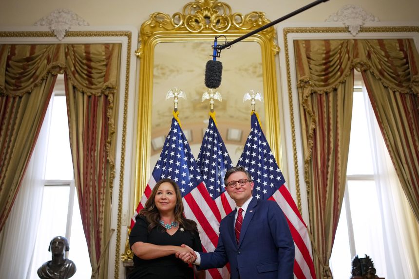 Rep. Adelita Grijalva poses for a photo with Speaker of the House Mike Johnson during a ceremonial swearing-in on Wednesday.