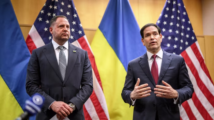Marco Rubio and Andriy Yermak speak at a press conference with US and Ukrainian flags in the background