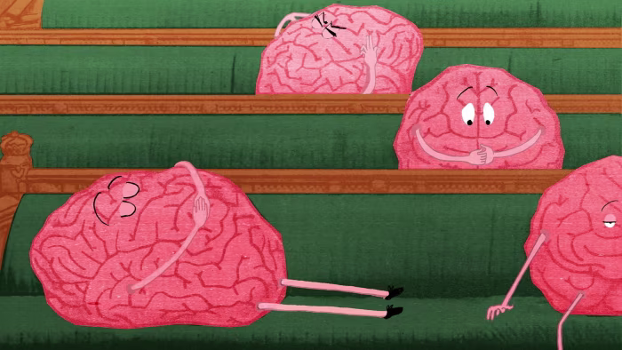 An illustration showing cartoon brains with faces and arms sitting on parliament’s benches, with some appearing sleepy or confused