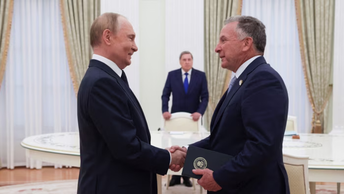 Vladimir Putin shakes hands with Steve Witkoff