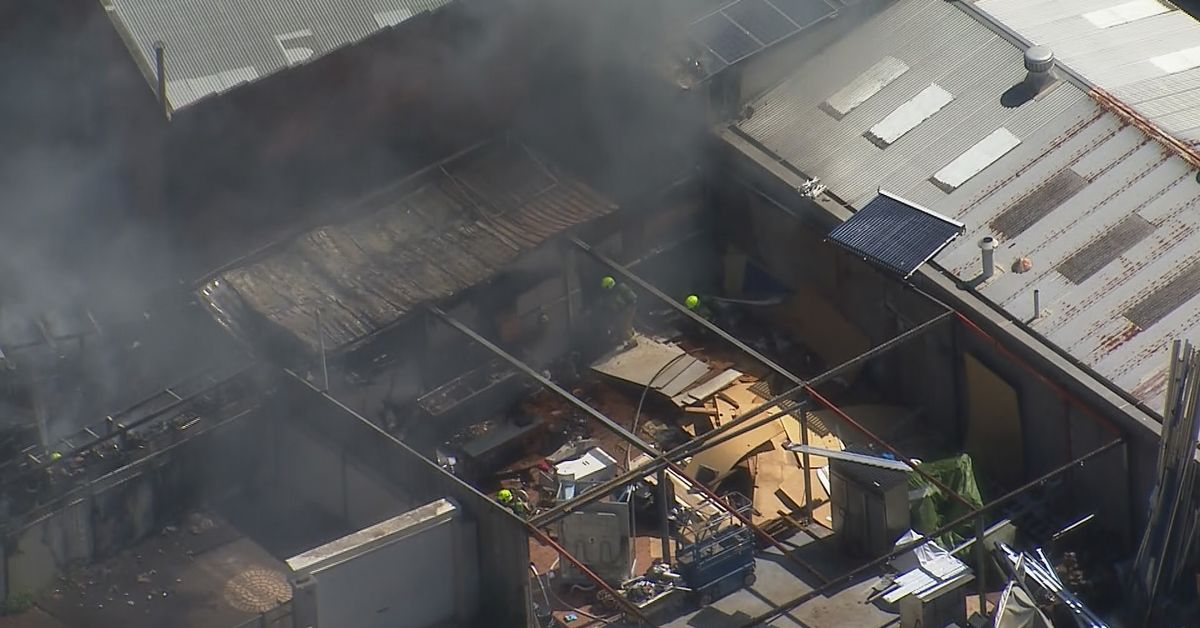 Dozens of firefighters battle blaze at furniture factory in Sydney's west