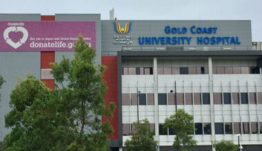 Pair on the run after Gold Coast teen stabbed on Molendinar doorstep over 'debt'