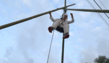 Pro-Palestine activist suspended from giant tripod in Brisbane