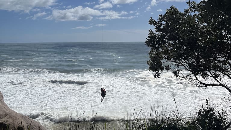 A man is airifted off Whiritoa Beach in Coromandel Thursday.