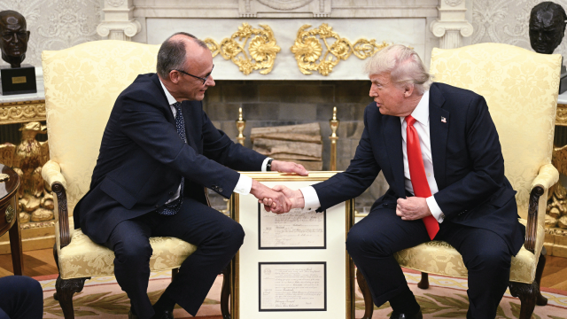 U.S. President Donald Trump and German Chancellor Friedrich Merz shake hands during a bilateral meeting in the Oval Office of the White House on June 5, 2025. (Brendan Smialowski/AFP via Getty Images)