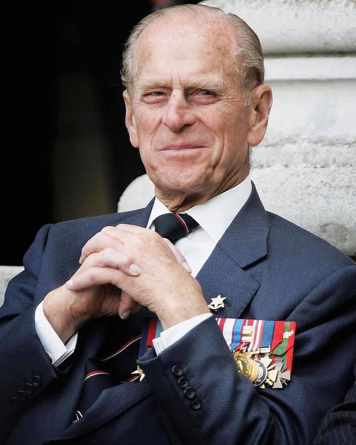Prince Philip in a suit with medals, reportedly warning Prince Harry before his Meghan Markle wedding, biographer claims.