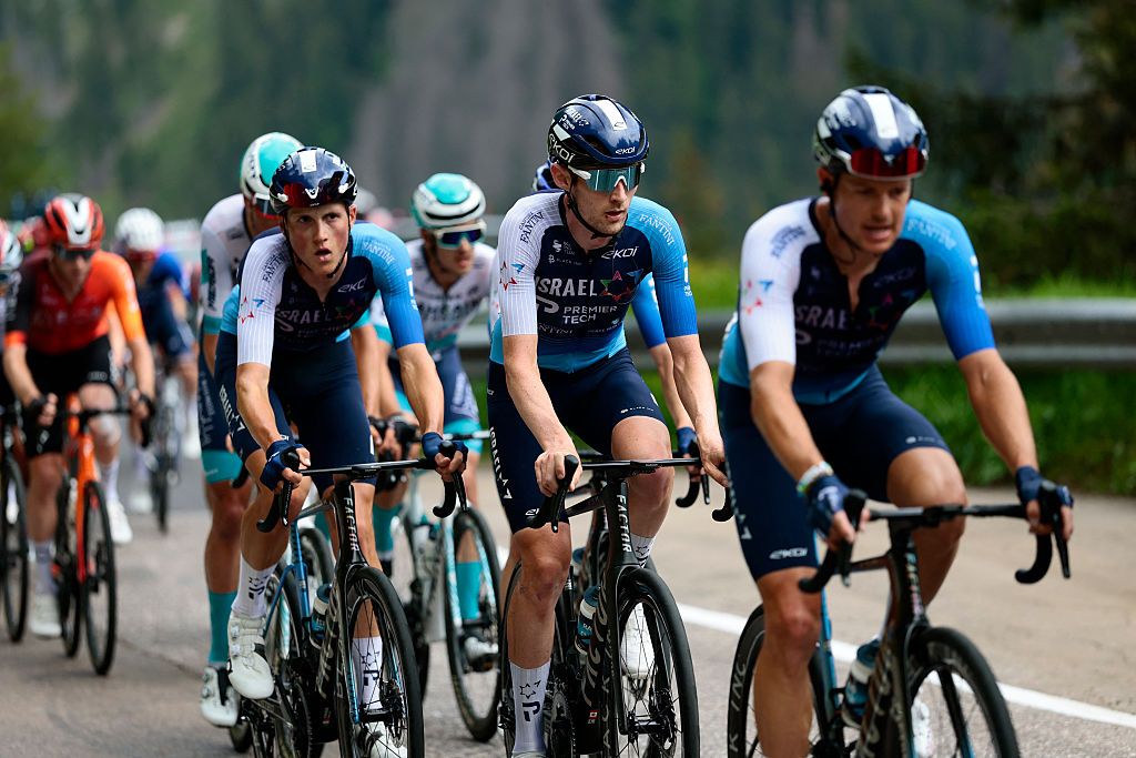 Israel-Premier Tech's Canadian rider Derek Gee (C) rides in the pack during the 17th stage of the 108th Giro d'Italia cycling race, 155kms from San Michele all'Adige to Bormio, on May 28, 2025. (Photo by Luca Bettini / AFP)
