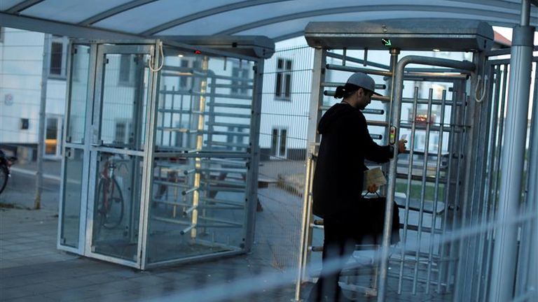 A man walks through the gate at a departure centre for rejected asylum seekers in Jutland, Denmark in March 2019. Pic: Reuters