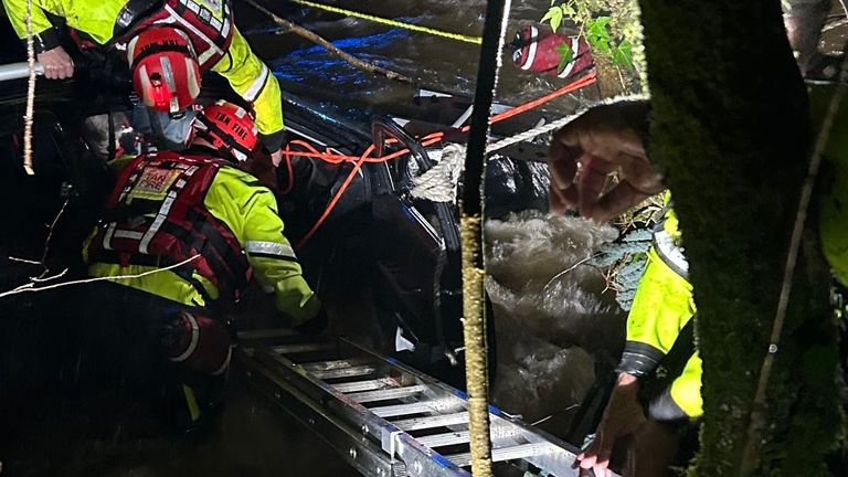 Three people were trapped in a vehicle in fast-flowing water. Pic: MAWWFRS