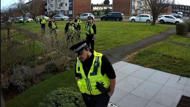 Police officers standing outside the couple's home. Pic: Maxie Allen/Times Radio