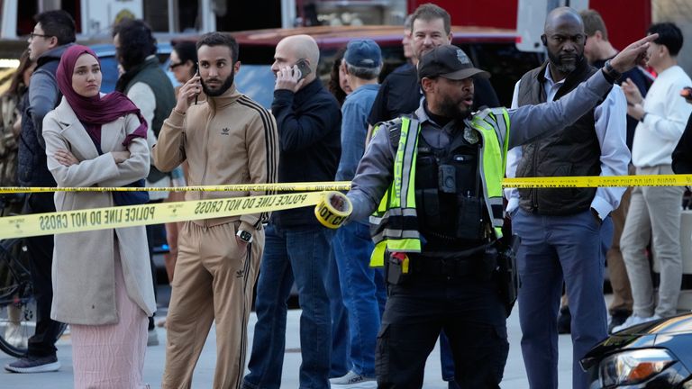 Emergency personnel cordon off an area near where National Guard soldiers were shot. Pic: AP