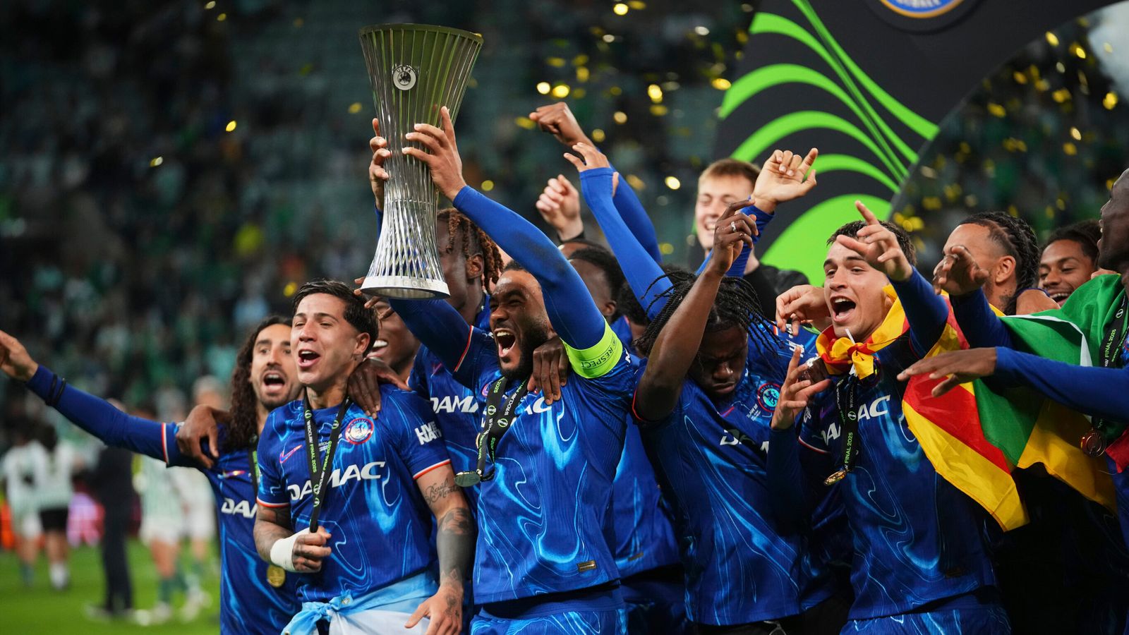 Chelsea players celebrate with a trophy after the Europa League final soccer match between Real Betis and Chelsea in Wroclaw, Poland, Wednesday, May 28, 2025. (AP Photo/Petr David Josek)