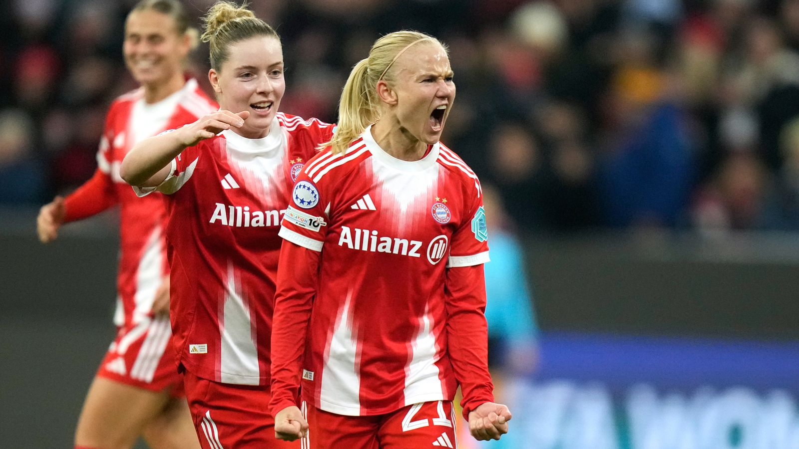 Bayern's Pernille Harder, right, reacts after scoring her side's second goal during the women's Champions League opening phase soccer match between FC Bayern Munich and Arsenal FC in Munich, Germany, Wednesday, Nov. 12, 2025. (AP Photo/Matthias Schrader)