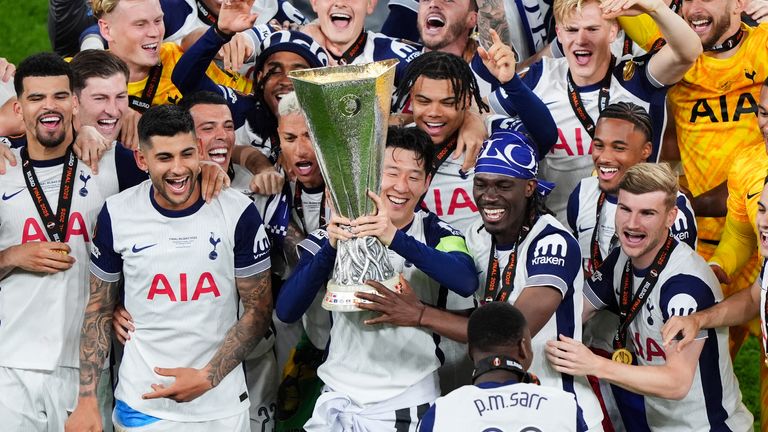 Heung-Min Son lifts the Europa League trophy as Tottenham players celebrate