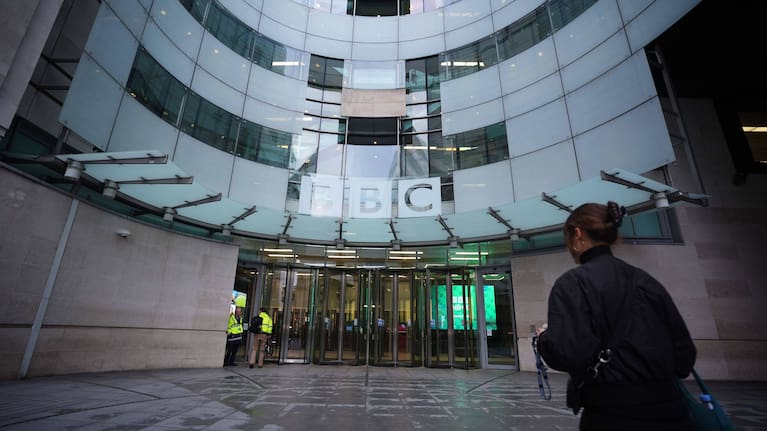Staff arrive at BBC Broadcasting House in London.