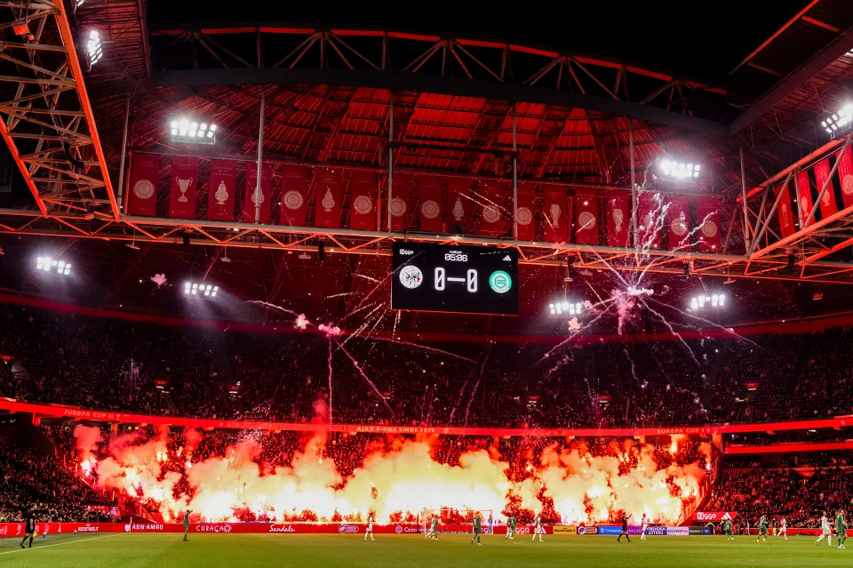 Supporters set off fireworks in memory of a deceased fan during the Dutch Eredivisie match between Ajax v FC Groningen at the Johan Cruijff Arena on November 30, 2025 in Amsterdam Netherlands 