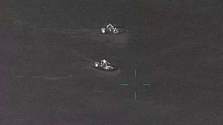 The two IRBs search for the missing surfer off Piha.