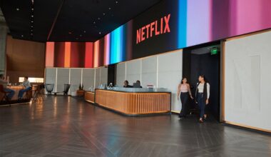 A spacious lobby with the Netflix logo above the reception desk.