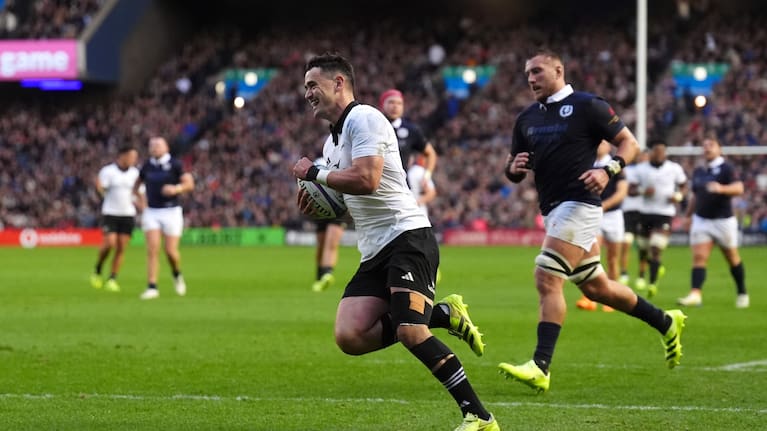 Will Jordan runs in for his try for the All Blacks just before halftime.