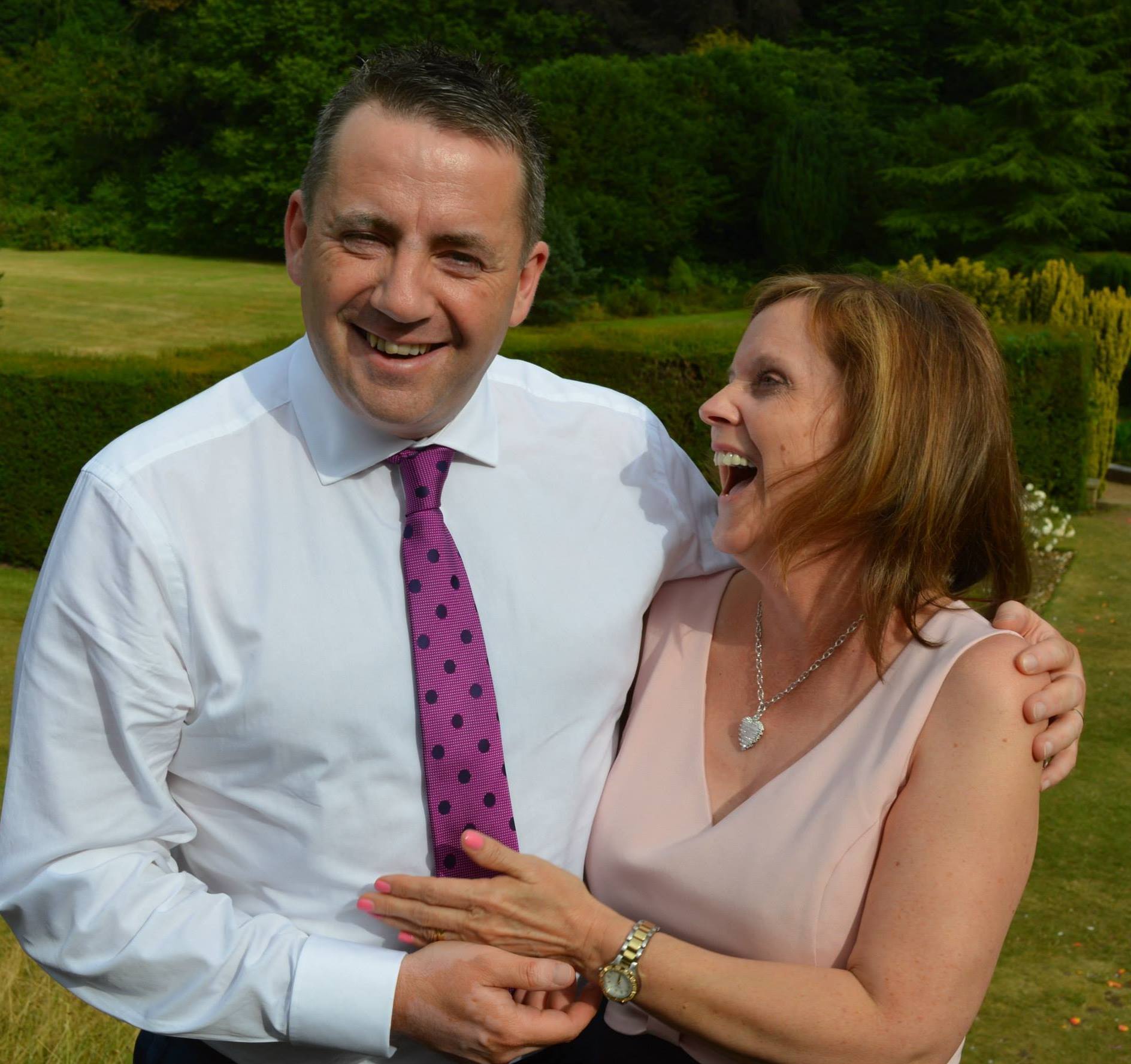 John Hunt and Carol Hunt laughing together.