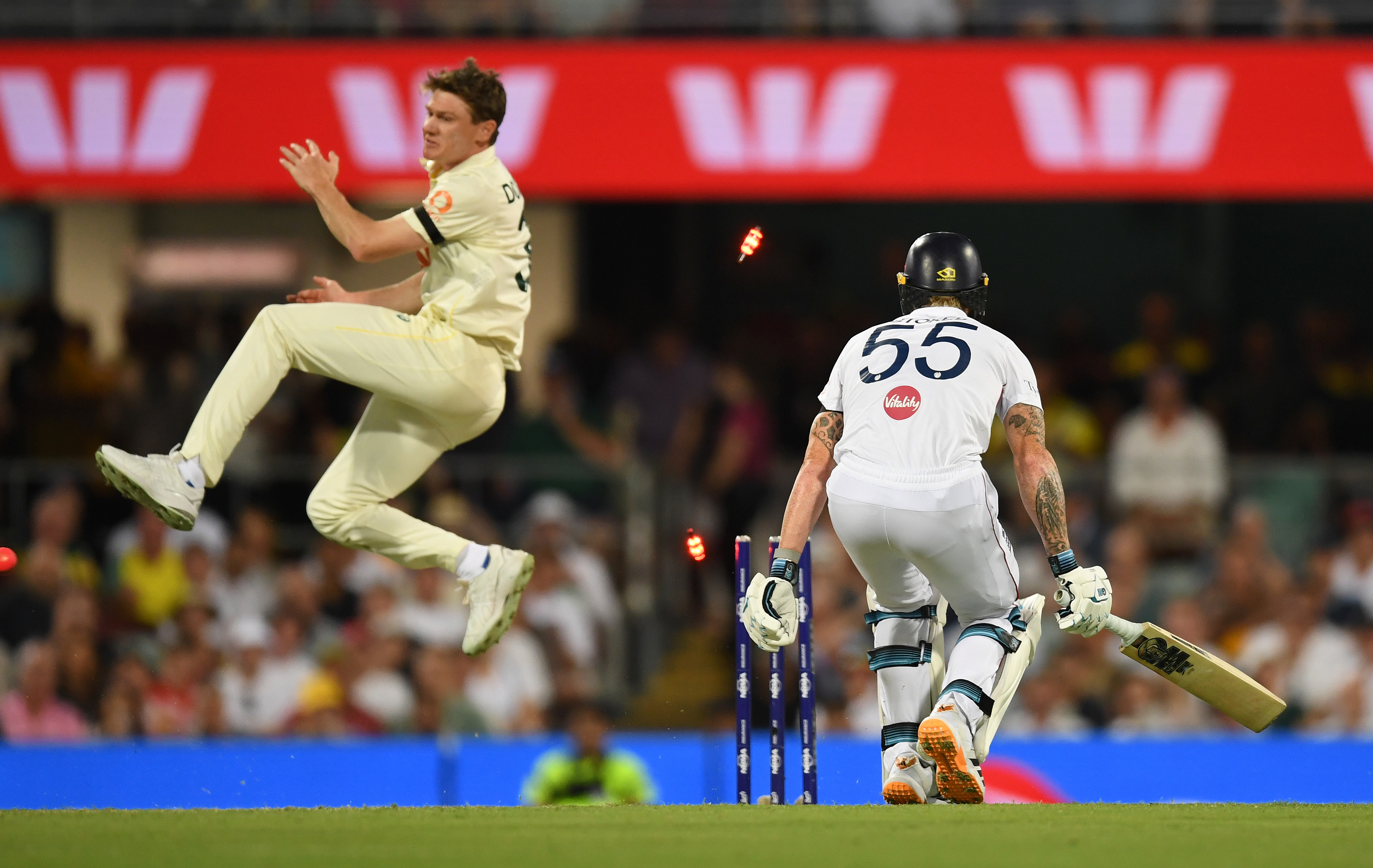 Brendan Doggett reacts as Ben Stokes is run out during a cricket match.